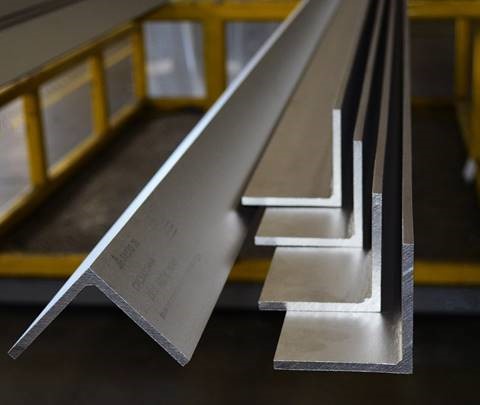 Steel angle sections stacked in warehouse for construction use